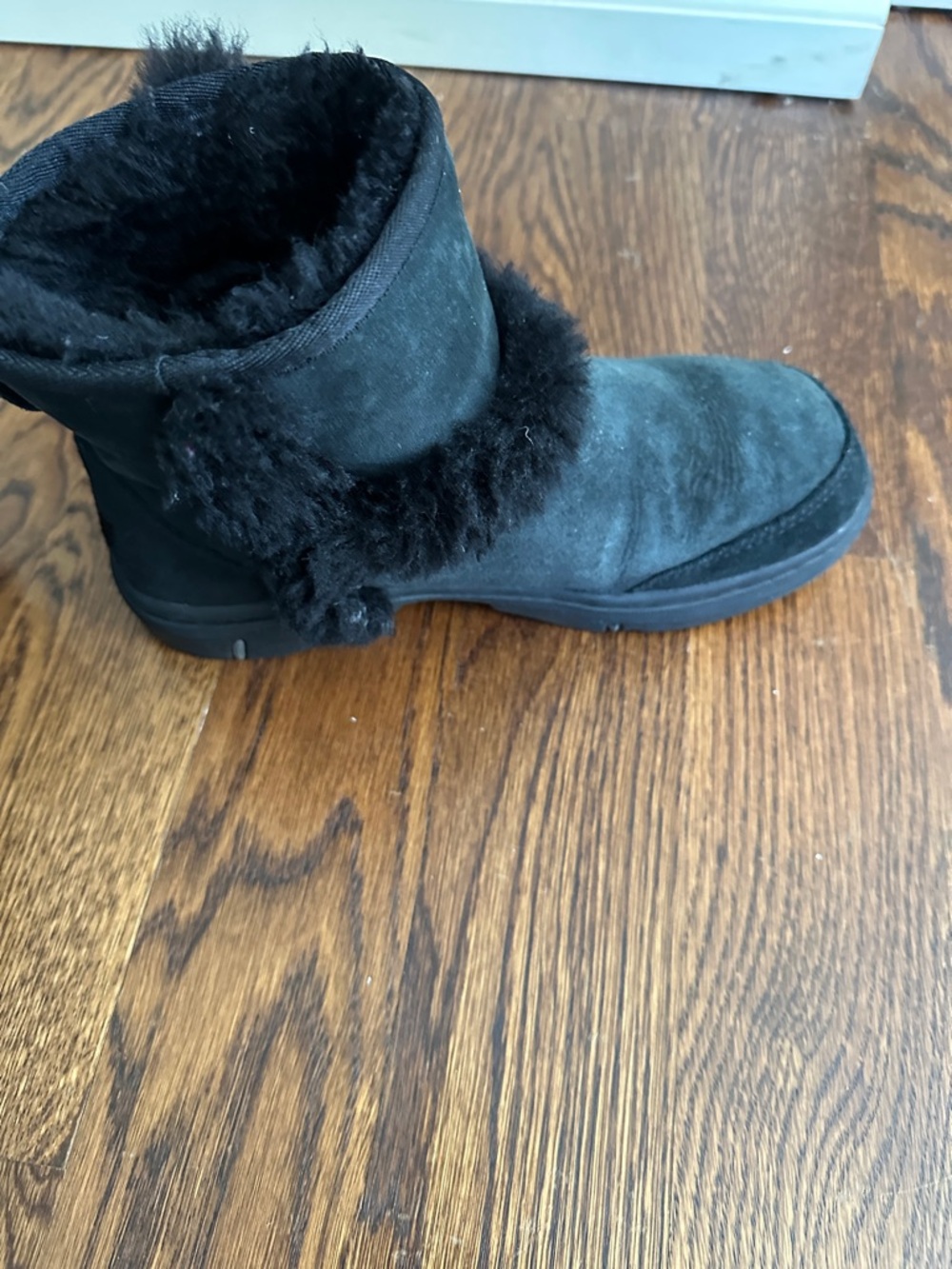 UGG Black Short Shearling Boot with Pom Detail - Picture 8 of 10
